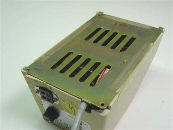 Nikon XN Transformer top view showing ventilation slots on metal top panel and attached gray AC power cord