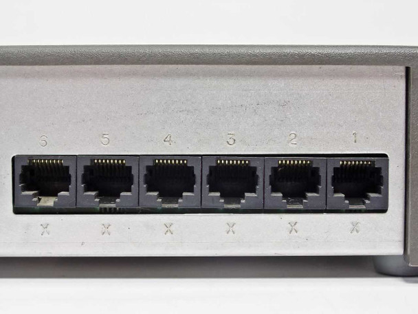 IBM 8222 rear panel close-up showing six RJ-45 Ethernet ports numbered 1 through 6 with light surface scratches on panel
