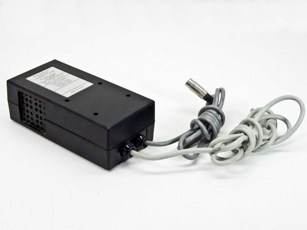 Data Comm for Business 9501008 DC Output Supply – rear-right view showing ventilation slots and 5-pin DIN output connector end