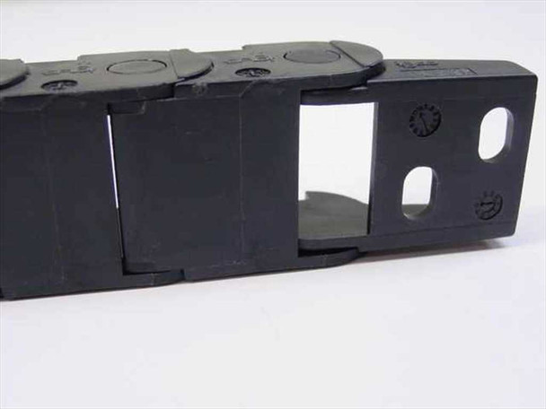 igus 14.2.028 E-Chain angled view showing open link design, interior cable channel, and end bracket mounting slots