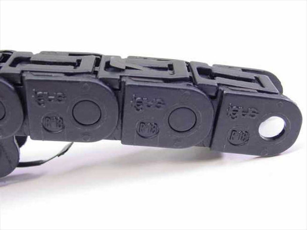 Igus 07 Series E-chain cable carrier close-up top view showing molded igus and P10 markings on articulated links