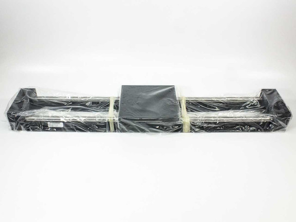 Thomson 2EA12FABL36 linear slide stage fully wrapped in factory plastic, full-length view showing rail and carriage table