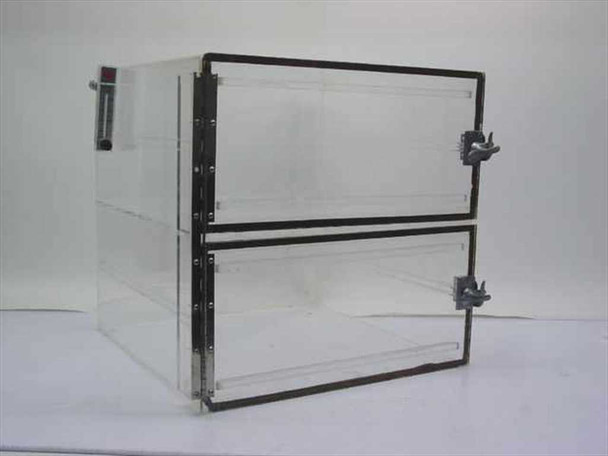 Dwyer RMA-6-SSV acrylic desiccator – front-right 3/4 view showing two-compartment cabinet with black rubber door seals, toggle clamp latches, and flow meter on left side panel