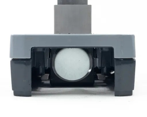 American Optical AO 561-1 base — front view with frosted white glass stage plate installed