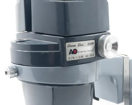 American Optical AO 569 Stereo Star label closeup showing 0.7X to 3.0X zoom range and AO branding