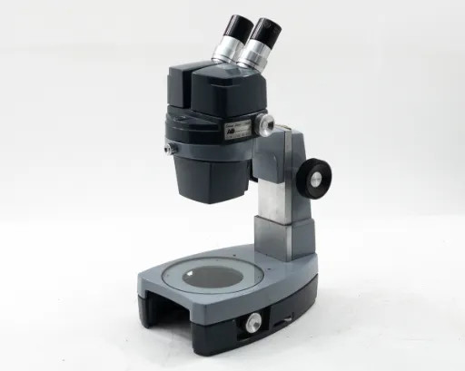 American Optical AO 569 Stereo Star Zoom Microscope with binocular head and 561-1 base — front three-quarter view