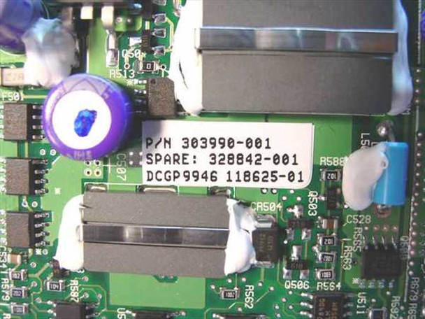 Compaq 303990-001 processor board label close-up showing P/N 303990-001 and Spare 328042-001
