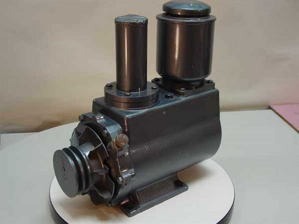 ULVAC D-950 Oil Rotary Vacuum Pump front-left view showing pump body, two cylindrical oil reservoirs, and belt drive pulley