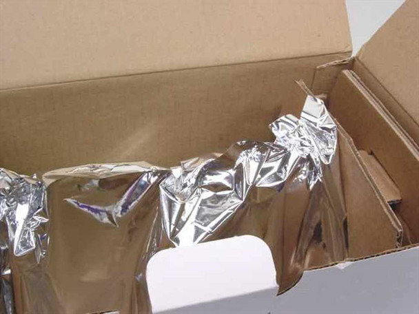 Interior of opened Roxbury RTC 61X toner cartridge box showing cartridge sealed in protective foil bag