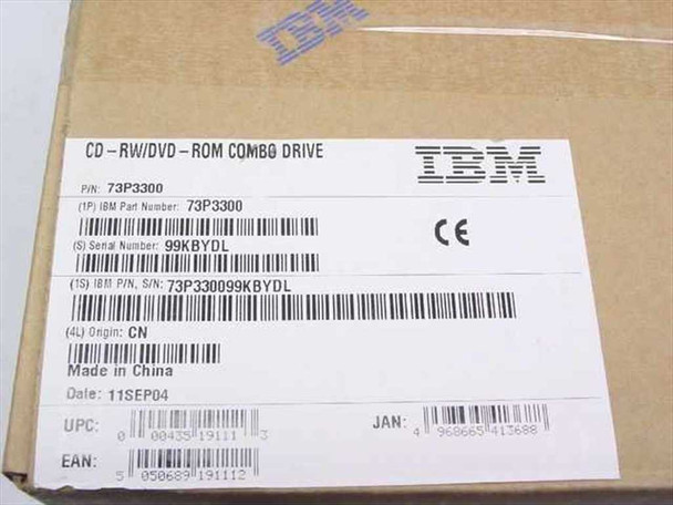 IBM 73P3300 CD-RW/DVD-ROM Combo Drive — box label showing IBM logo, part number 73P3300, serial number 99KBYDL, origin CN, date 11SEP04, UPC and EAN barcodes