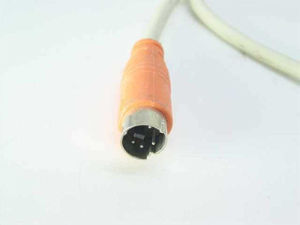 Compaq 166514-001 keyboard Mini-DIN PS/2 connector close-up showing orange strain relief and 6-pin plug