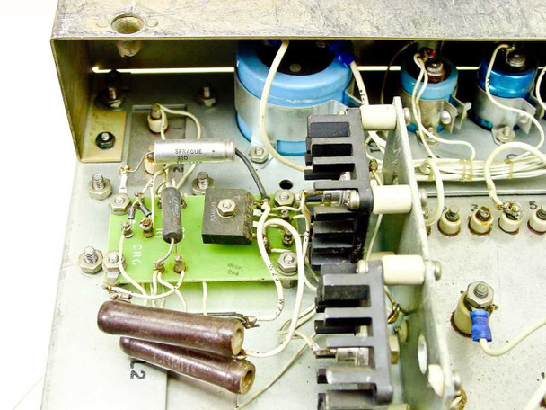 RCA MI-560772 Raw DC Power Supply — close-up of internal PCB with Sprague capacitor, resistors, and finned heat sink assembly
