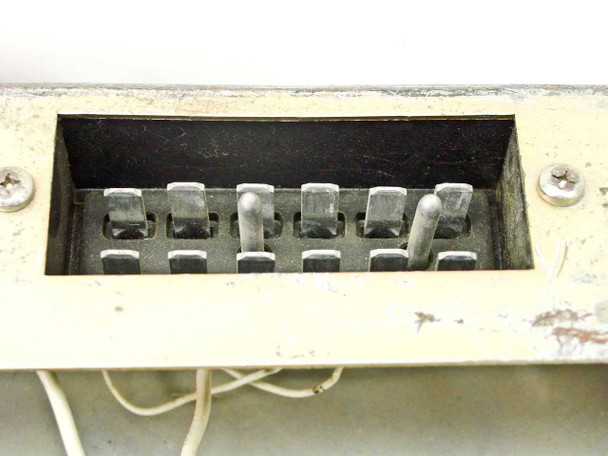 RCA MI-560772 Raw DC Power Supply — terminal strip connection block visible through chassis opening, showing multiple screw terminals