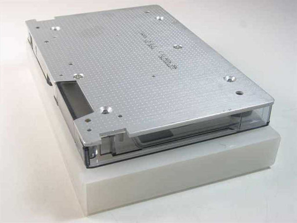 3M DC 600A Data Cartridge Tape DC600A — bottom/rear view showing metal chassis and tape cartridge mechanism on foam tray