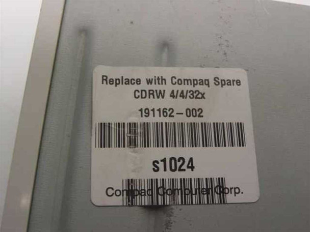Compaq spare part label reading CDRW 4/4/32x part number 191162-002 on top of Samsung SD-612 drive