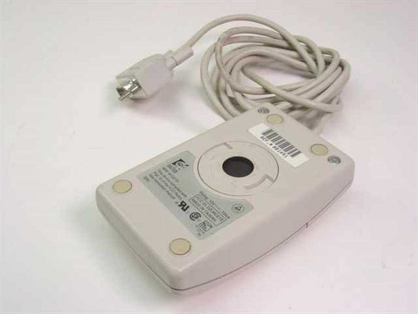 Logitech M-CE15 serial mouse – bottom view showing ball housing, rating label, four rubber feet, and UL/CSA markings