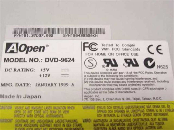 AOpen DVD-9624 bottom label showing model number, DC ratings (+5V/+12V), manufacture date January 1999, Made in Japan, part number 81.37037.002, and FCC/UL/CE certifications