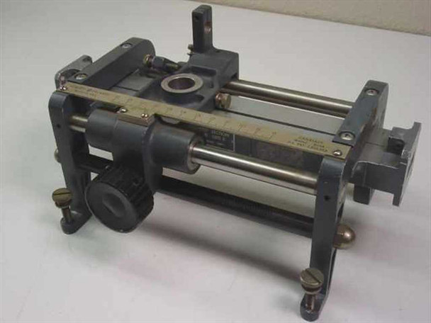 HP X810B Slotted Line front-left view showing carriage assembly, dual guide rails, graduated scale, empty detector mount, WR90 waveguide flanges, and leveling feet