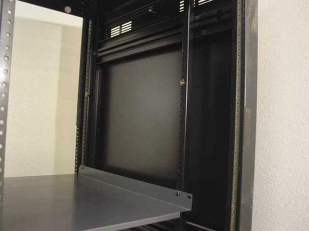 Winstead rackmount cabinet upper interior close-up showing rack rail mounting strips and installed shelf from side angle