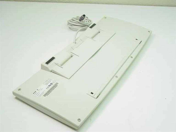 Acer 6311-C white PS/2 keyboard – bottom view showing underside, cable routing, and fold-out feet