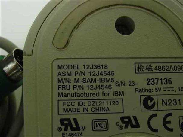 IBM 12J4545 mouse bottom label closeup showing model 12J3618, ASM P/N 12J4545, M/N M-SAM-IBM5, FRU P/N 12J4546, and FCC/UL/CE markings