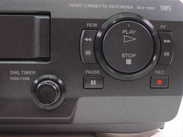 Sony SLV-N60 VCR — top-right control panel showing REW, FF, Play, Stop, Pause, Record transport buttons and Dial Timer knob