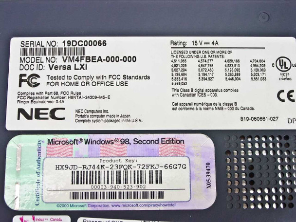 NEC Versa LXi VM4FBEA bottom label showing model VM4FBEA-000-000, serial number, 15V 4A rating, FCC and CE marks, and Windows 98 Second Edition COA sticker