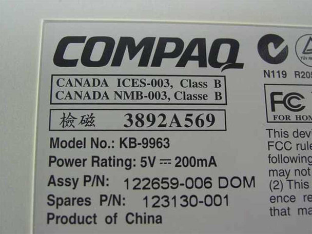 Compaq KB-9963 bottom label showing model number, part number 123130-001, assembly P/N 122659-006, and 5V 200mA power rating
