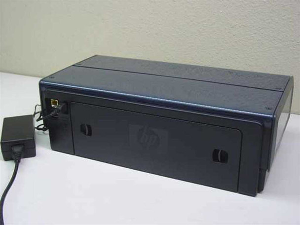 HP Deskjet 6840 C9029A rear view showing closed paper door and HP logo on dark blue casing, AC adapter visible at left