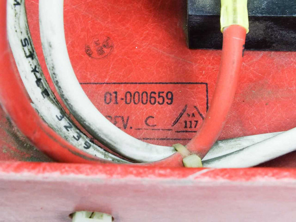 Label close-up on red metal tray showing assembly serial number 01-000659 and revision C marking