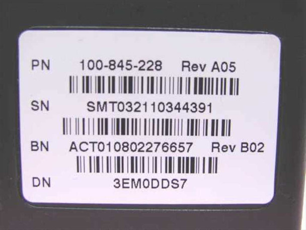 Close-up of EMC carrier label showing PN 100-845-228 Rev A05, SN SMT032110344391, BN ACT010802276657 Rev B02, DN 3EM0DDS7