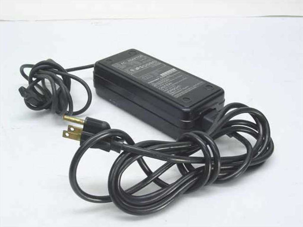 Toshiba PA2408U AC adapter front view showing black brick body with attached US 2-prong power cord