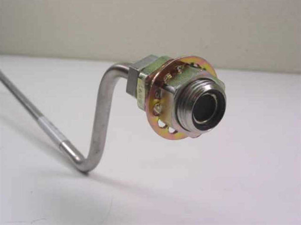 Close-up of male panel-mount fitting end on CTI Cryogenics 8143215 G002 helium compressor supply line — flange, O-ring groove, and threaded port visible