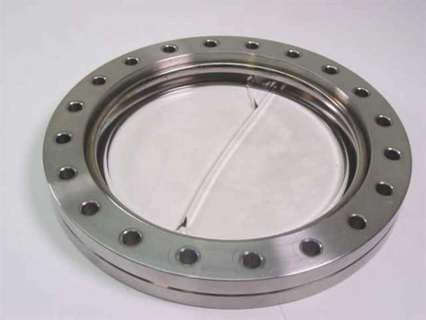 Vacuum Generators Ltd viewport flange angled view showing inner groove, cracked glass, and multi-bolt stainless flange body