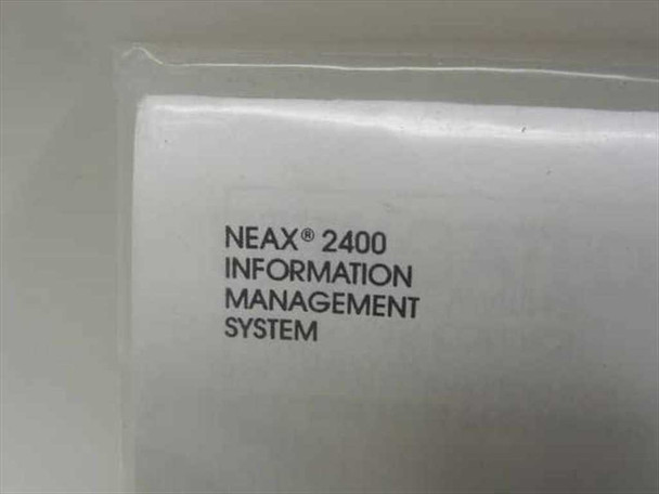 Close-up of packaging label reading 'NEAX 2400 Information Management System'
