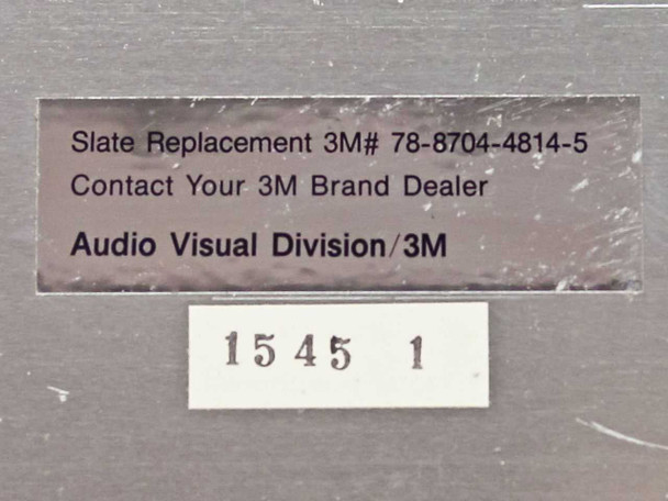 Label on 3M 5088 Fresnel lens slate reading 'Slate Replacement 3M# 78-8704-4814-5, Audio Visual Division/3M' with inventory number 1545 1