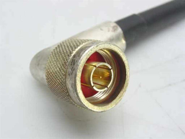 Close-up of N-type male connector on Times Microwave LMR-400 coax cable showing gold center pin and knurled body