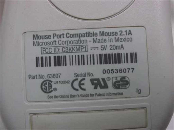 Microsoft 63607 mouse bottom label showing Part No. 63607, FCC ID C3KKMP1, 5V 20mA rating, Made in Mexico, and serial number