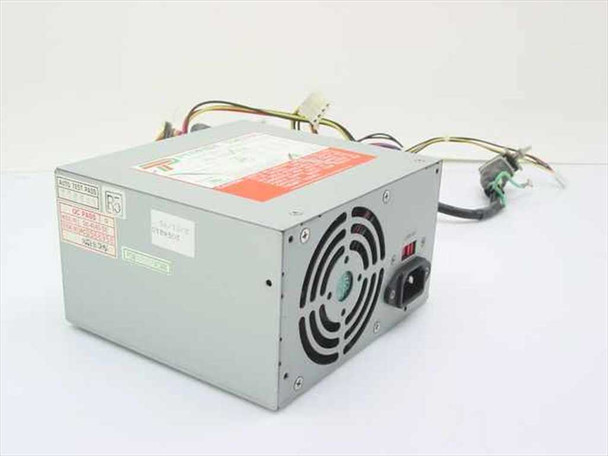 Power Tronics SK-4145DE 145W AT switching power supply — angled front view showing fan, IEC inlet, and output harness