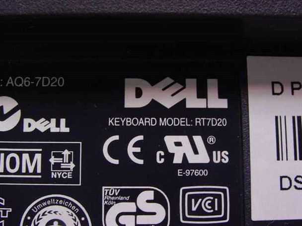 Dell RT7D20 keyboard bottom label close-up showing model number RT7D20, Dell logo, CE, UL, TÜV GS, and VCCI certifications