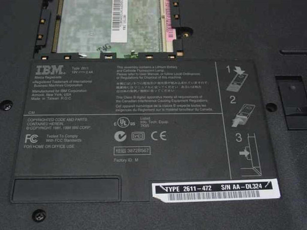 IBM ThinkPad 2611-472 bottom label showing Type 2611-472, 19V 2.4A rating, FCC markings, serial number AA-DL324, and open memory bay with RAM card visible
