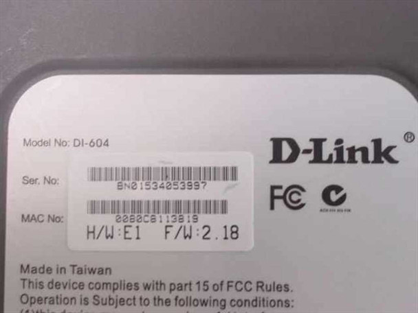 D-Link DI-604 bottom label showing model number DI-604, serial number, MAC address, hardware version E1, firmware 2.18, and FCC markings