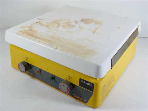 Barnstead Thermolyne SP47235 Cimarec 3 stirrer hot plate — front view showing yellow housing, ceramic top plate with brown staining, HEAT and STIR control knobs, and indicator lights