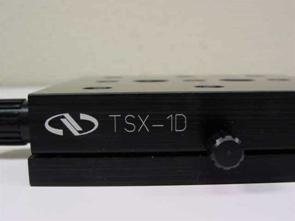 Newport TSX-1D dovetail linear stage – close-up side view of black anodized body with engraved Newport logo and TSX-1D model designation and adjustment knob