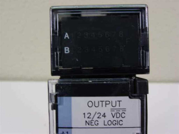 GE Fanuc IC693MDL741E output module — close-up of open terminal cover showing Group A and B terminal rows and OUTPUT 12/24 VDC NEG LOGIC label