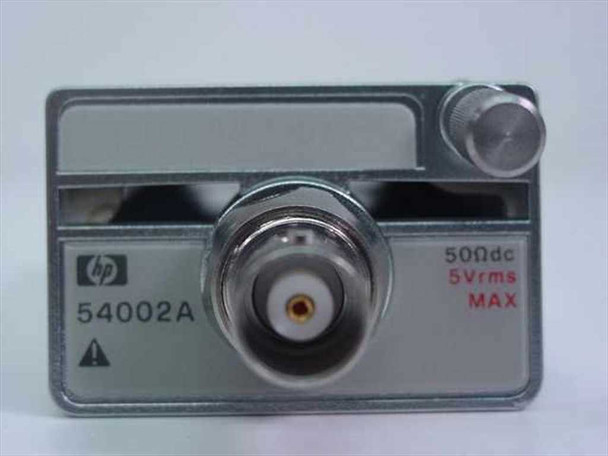 HP 54002A 50 Ohm Input Pod — front face close-up showing BNC connector, HP logo, model number, and 50Ωdc / 5Vrms MAX rating label