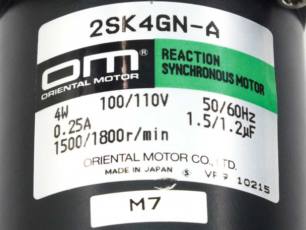 Oriental Motor 2SK4GN-A motor nameplate label showing model number, 4W, 100/110V, 50/60Hz, 0.25A, 1500/1800 RPM, and 1.5/1.2µF capacitor rating