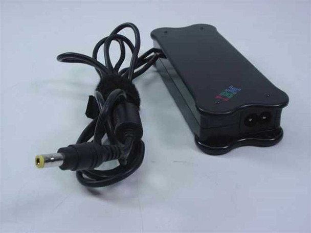 IBM 02K6661 AC adapter side view showing IEC C7 AC input port, IBM logo, and barrel plug output cable