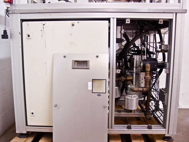 Lower base cabinet interior – left door open showing enclosed panel side; right bay open showing hydraulic/pneumatic plumbing, regulator, and wiring