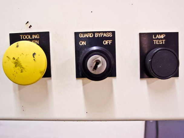 Control panel secondary buttons – Tooling Return (yellow), Guard Bypass On/Off (key switch), and Lamp Test buttons